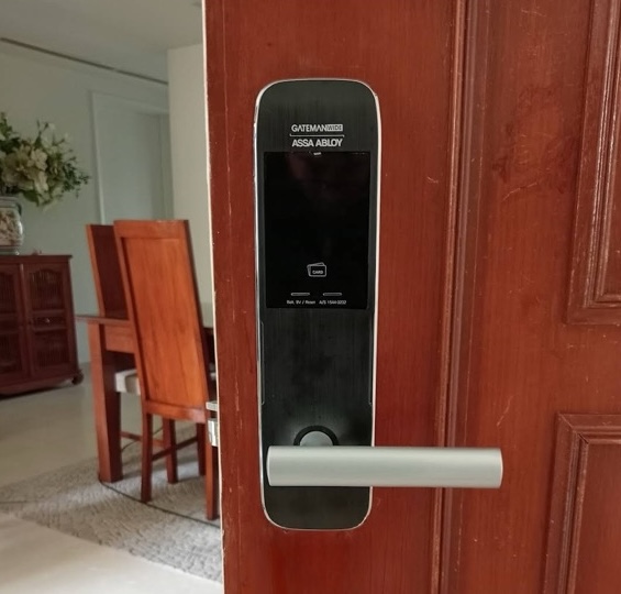 Assa Abloy Gateman digital lock installed on a wooden main door.